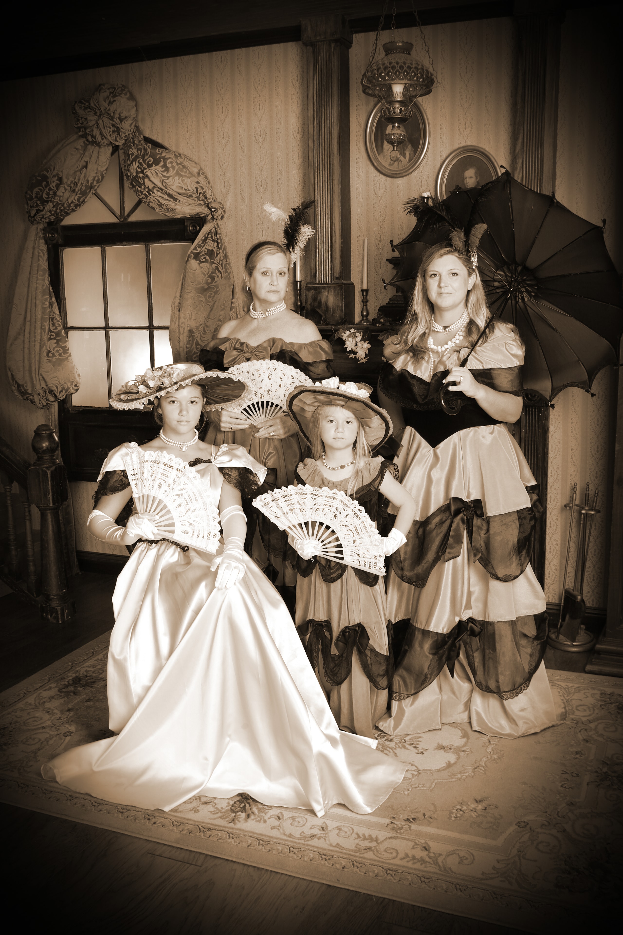 Victorian group portrait with fans and parasols