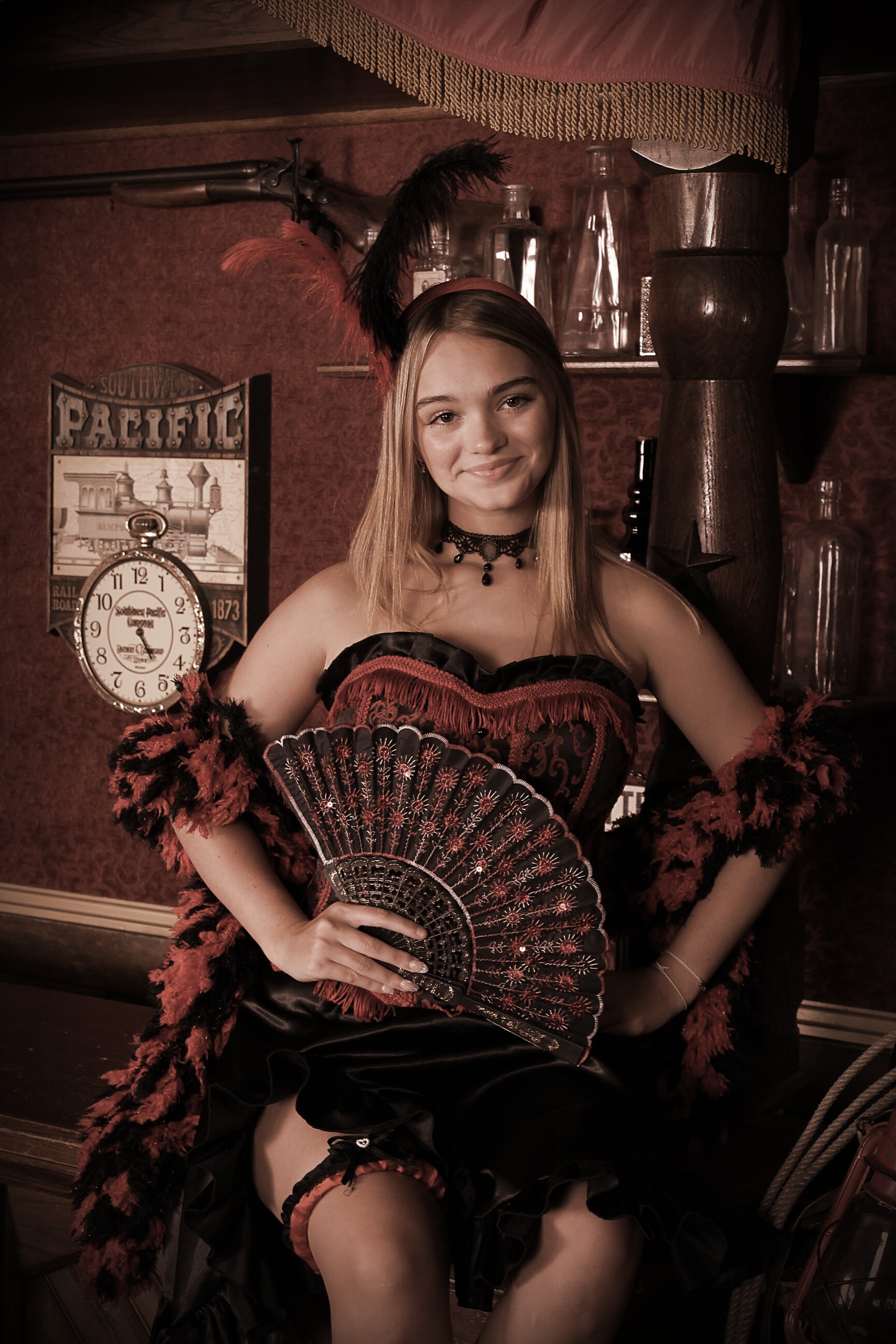 Woman in saloon girl costume with feather fan
